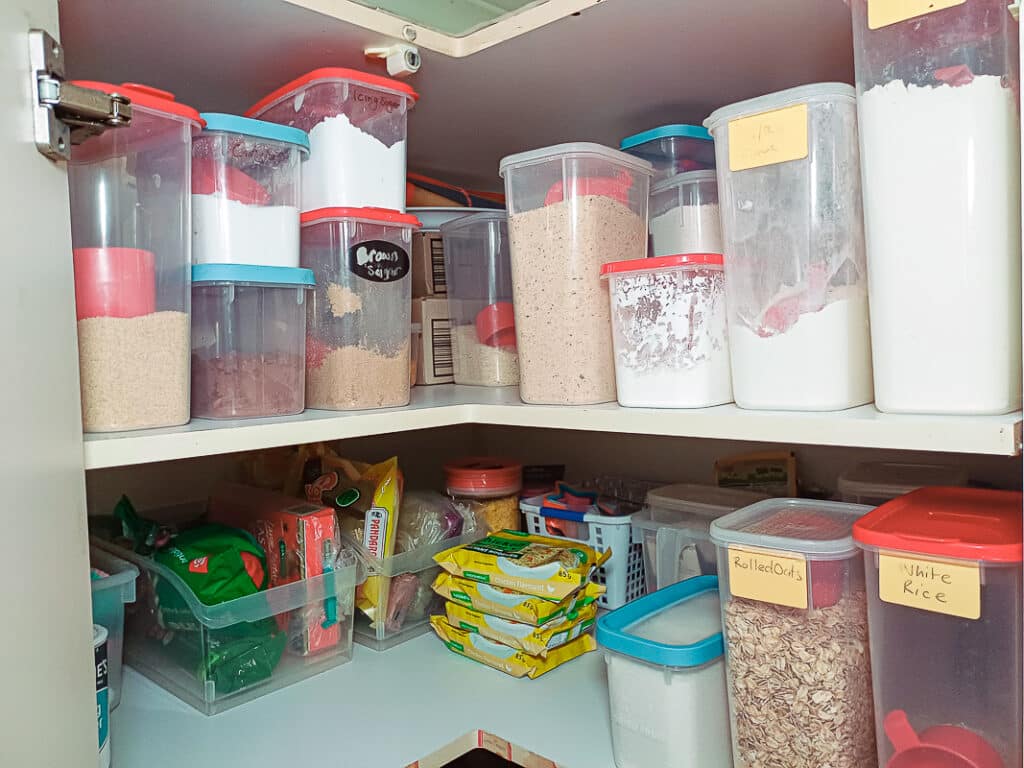 pantry staples in containers in corner pantry