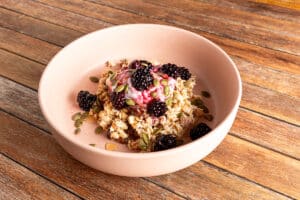 homemade bircher muesli with yoghurt and blackberries