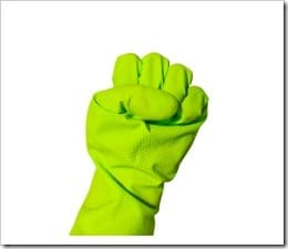 Fist sign in green vinyl glove