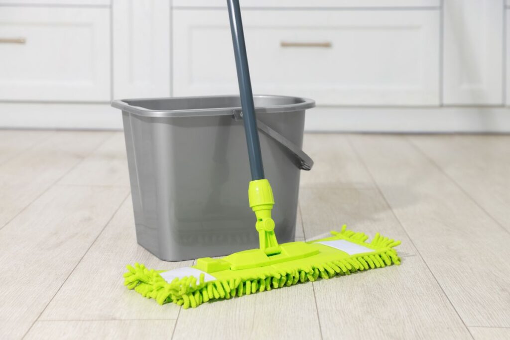 mop and bucket on pale floor representing easy diy floor cleaner