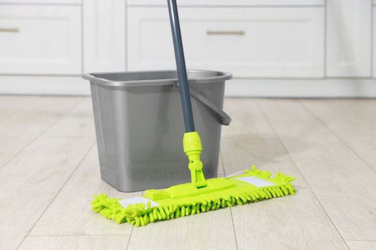 mop and bucket on pale floor representing easy diy floor cleaner