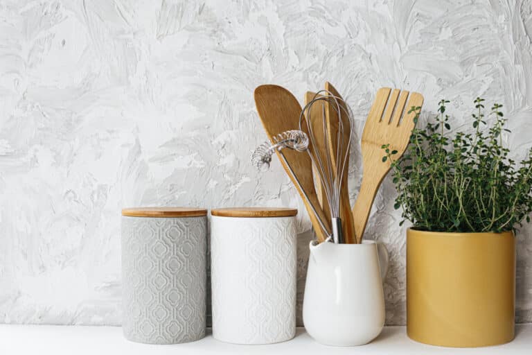 canisters, plant, kitchen utensils white background