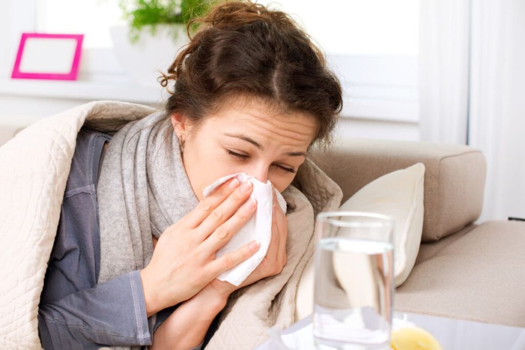 woman blowing her nose