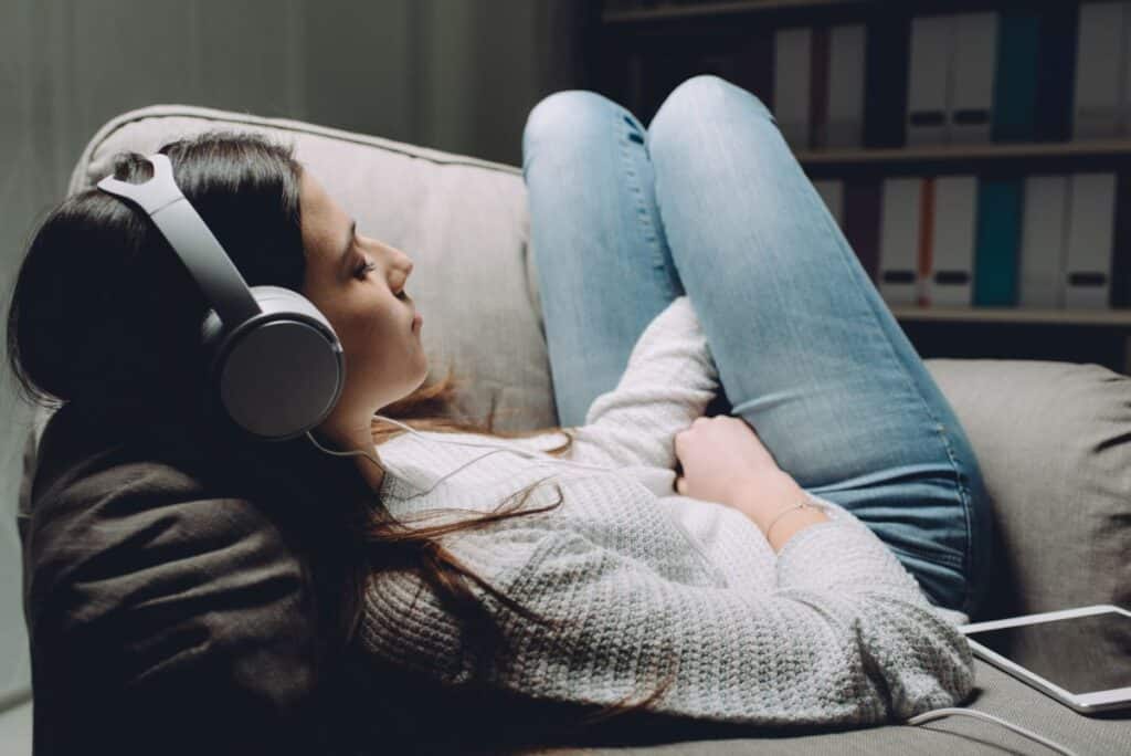 teenager listening to music with headphones