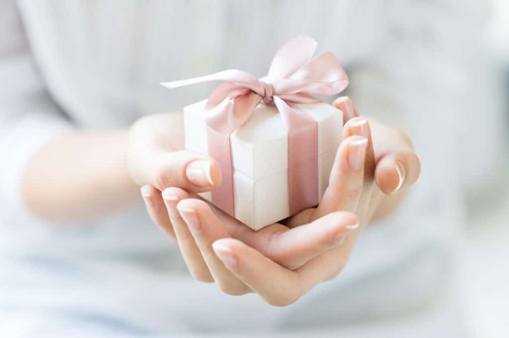 pink and white gift box how to give a thoughtful gift