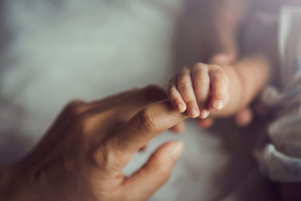 mother and baby hand