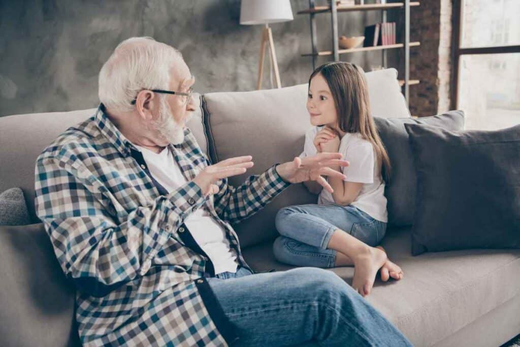 granddad telling story to granddaughter