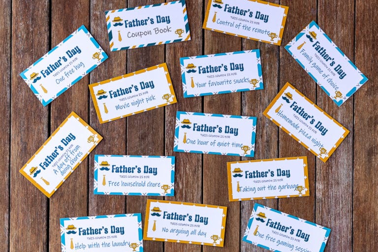 printable father's day coupons spread out on a table