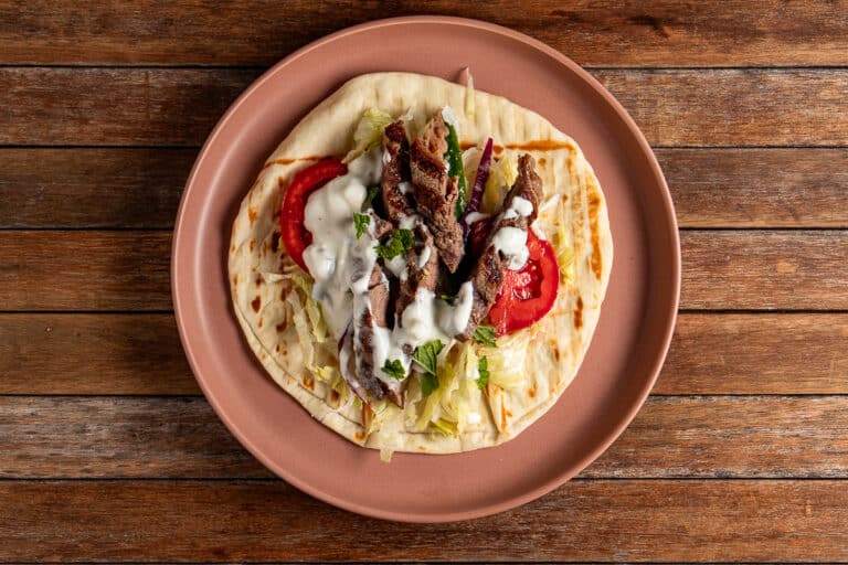 open souvlaki wrap on a plate