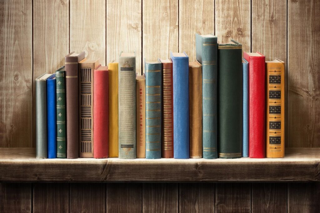 old books on a wooden shelf